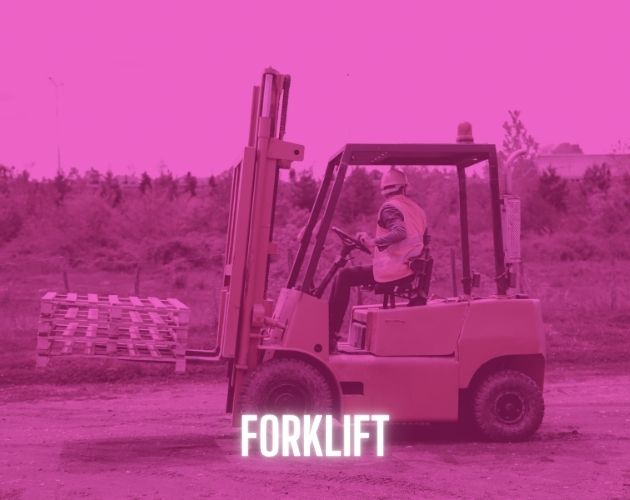 Forklift with operator loading materials on a job site in Qatar”